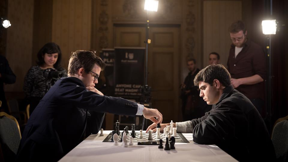 Image Represents A Person make a move in chess game and the other person watching and waiting for his next move